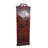 A 19th century inlaid mahogany floor standing corner display cabinet on bracket feet,