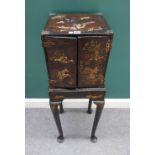 An 18th century black lacquer chinoiserie decorated table cabinet,