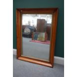 A 19th century birds eye maple framed rectangular wall mirror with gilt slip,