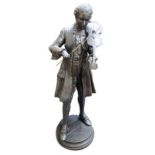 A modern bronze figure depicting a young man in Georgian period costume playing the violin,