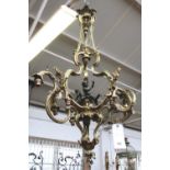 A French gilt and patinated bronze nine light chandelier, late 19th/early 20th century,