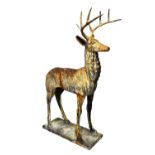 A 20th century cast iron life sized figure of a standing red deer, 180cm high x 120cm wide.