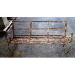A 19th century wrought iron three seat garden bench with scroll end supports,