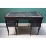 Morison & Co, Edinburgh; a 19th century ebonised writing desk, with nine drawers about the knee,