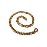 A gold neckchain, in a circular link design with pairs of twin baton shaped links at intervals,