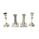 A pair of Victorian silver candlesticks, each formed as a classical fluted column,