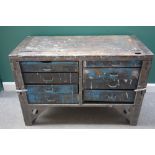 20th century industrial design; a metal bound chest of eight short wooden drawers.