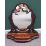 A large Victorian mahogany quatrefoil shaped swing frame toilet mirror on shaped base,