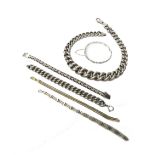 A group of mostly silver jewellery, comprising; a graduated curb link neckchain,