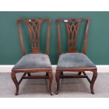 A pair of late George III mahogany side chairs, each with pierced splat back and straight seat,