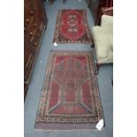 A Ghasghai rug, Persian, the madder field with three medallions and flowers,