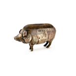 A silver pin cushion, modelled as a standing pig, length 8cm, Birmingham 1906.