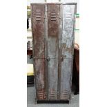 20th century industrial design; a three section steel locker cabinet, 69cm wide x 183cm high.