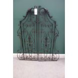 A pair of mid 20th century French wrought iron gates with acanthus scroll decoration,