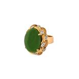 A gold, nephrite and diamond ring,