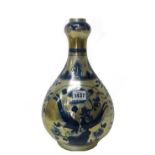 A Chinese 'clobbered' blue and white onion vase, 19th century, of pear form with onion neck,
