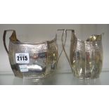 A George III silver twin handled sugar bowl and a matching milk jug,