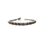 A pale magenta sapphire and colourless gem set bracelet,