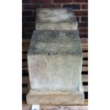 A pair of reconstituted stone square plinths on stepped bases, 47cm wide x 47cm high.