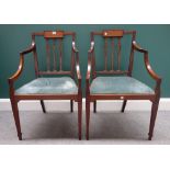 A pair of Edwardian mahogany open armchairs, on tapering square supports, 54cm wide x 88cm high.
