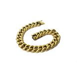 A gold hollow uniform curb link bracelet, on a snap clasp, bears indistinct marks,