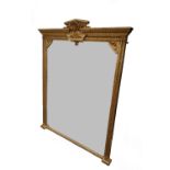 A Victorian gilt framed overmantel mirror, with shell crest and floral moulded frame,