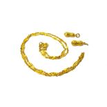 An Oriental gold neckchain, in an 'S' pierced oval and bead link design, on a serpentine clasp,
