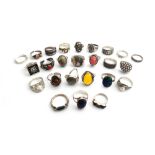 Twenty-five mostly silver and gem set rings, in a variety of designs, (25).