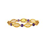 A gold and amethyst bracelet in an oval and twin bar link design,