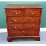 A George III crossbanded mahogany chest of two short and three long graduated drawers,