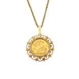 A George V sovereign 1913, in a 9ct gold pendant mount, decorated with a pierced border,
