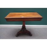 A William IV rosewood card table, with rectangular top on a carved column and trefoil platform,