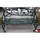 A 19th century green painted cast iron garden bench of naturalistic tree form,