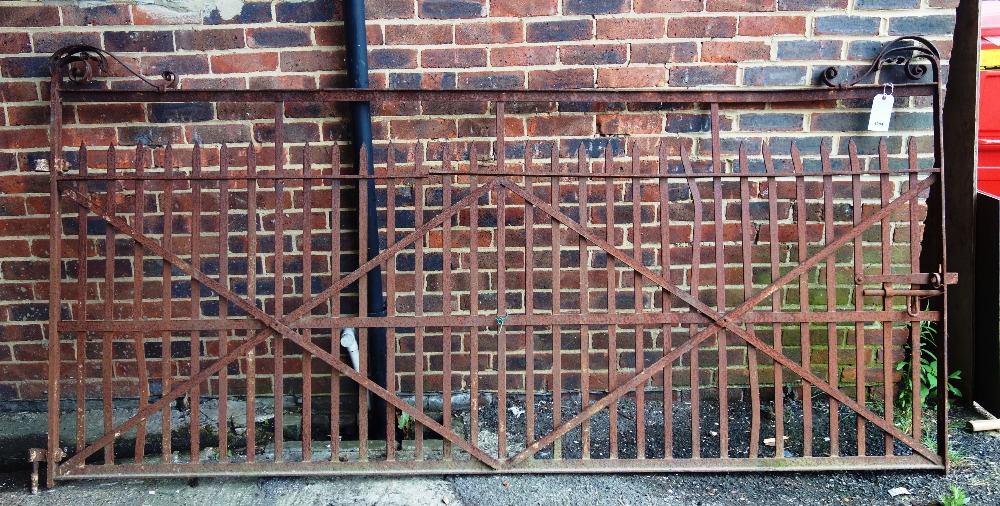 A wrought iron estate gate, 291cm wide, including bracket x 137cm high.