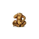 A Japanese ivory netsuke of a monkey, late 19th century, seated with its young playing in its lap,
