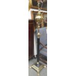 A Victorian style brass and ebonised adjustable standard lamp (converted),