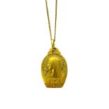 A gold pendant, designed as the portrait of a Madonna,