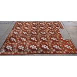 An English gros point carpet, the brown field with floral sprays of roses and lilies,