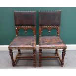 A set of six late 19th century Italian carved walnut square back dining chairs with studded leather