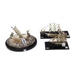 Two models of three masted sailing ships,