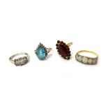 An 18ct gold and opal five stone ring, mounted with a row of five graduated oval opals,