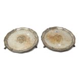 A pair of George III silver salvers, each of shaped circular form,