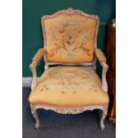 A pair of Louis XV style grey painted open armchairs with carved frames and serpentine seat,