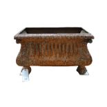 A Victorian cast iron planter of bombe form, on lion's paw feet, 70cm wide x 42cm high.