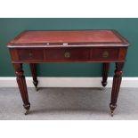 A Victorian mahogany three drawer writing table, on tapering reeded supports, 98cm wide x 75cm high.