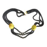 A 9ct gold and haematite bead necklace,