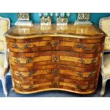 An 18th century and later German mahogany banded walnut double bowfront chest of four long