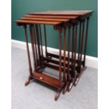 A nest of four 19th century inlaid mahogany occasional tables on turned supports,