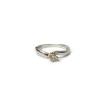 An 18ct white gold and diamond single stone ring,
