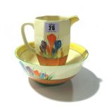 A Clarice Cliff Bizarre bowl, a similar jug and a pair of blue and gilt lidded vases, (4).